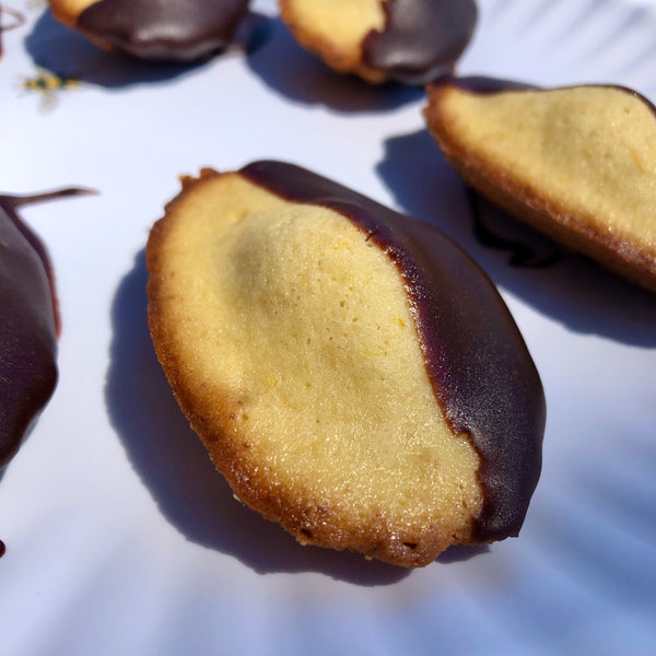 Close-up on chocolate-dipped madeleines
